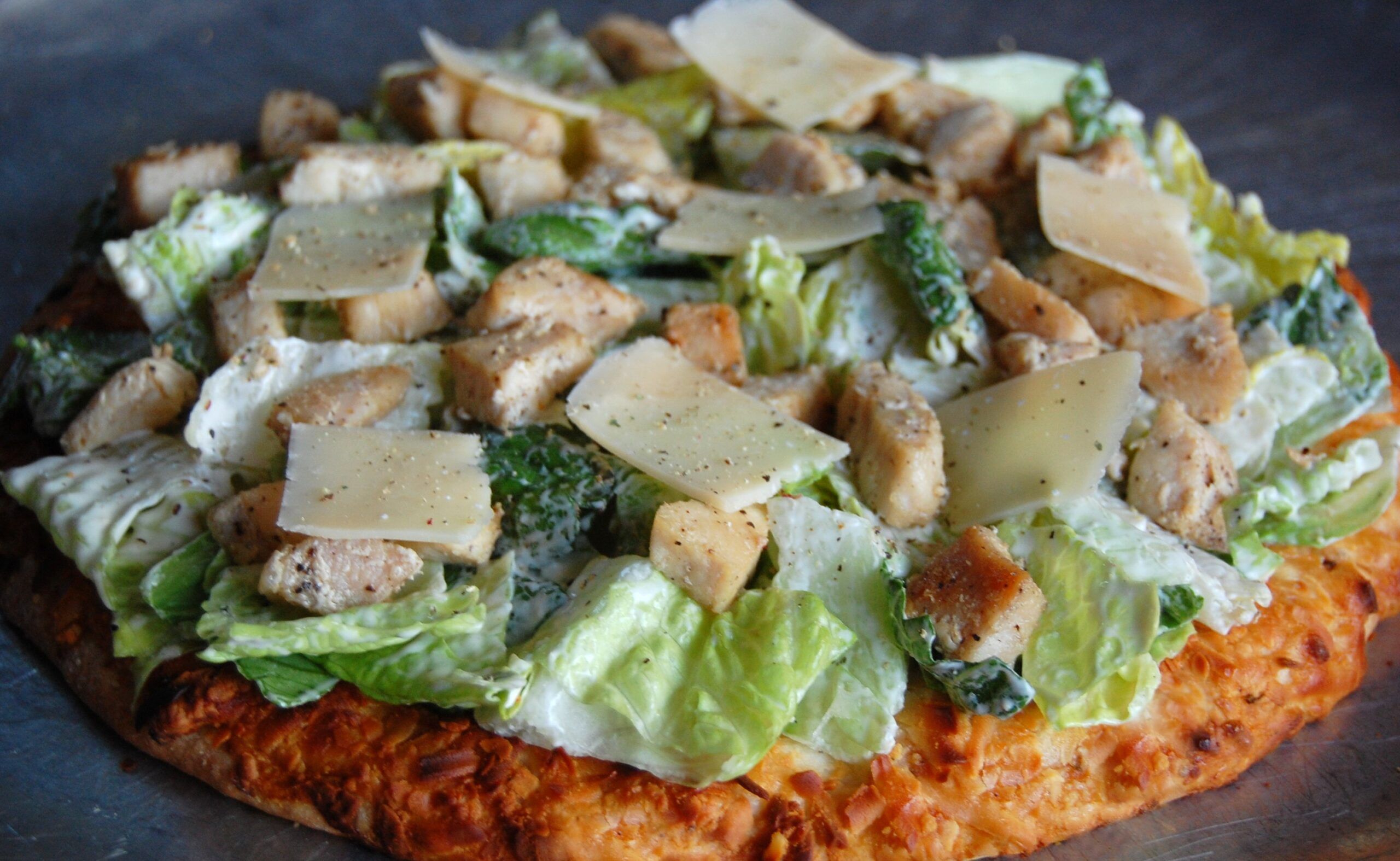 Discover the Irresistible Caesar Pizza: A Perfect Delight for Food Lovers at The Monroe Hotels