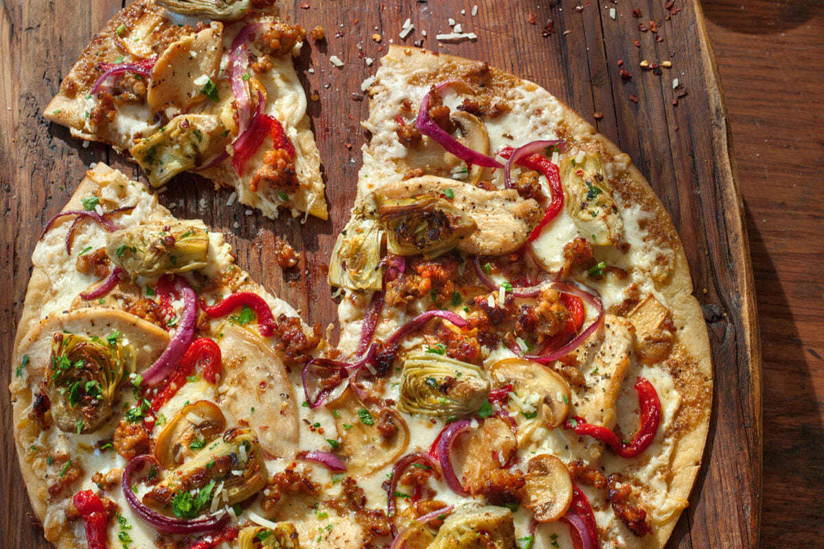 Discover the Irresistible Caesar Pizza: A Perfect Delight for Food Lovers at The Monroe Hotels