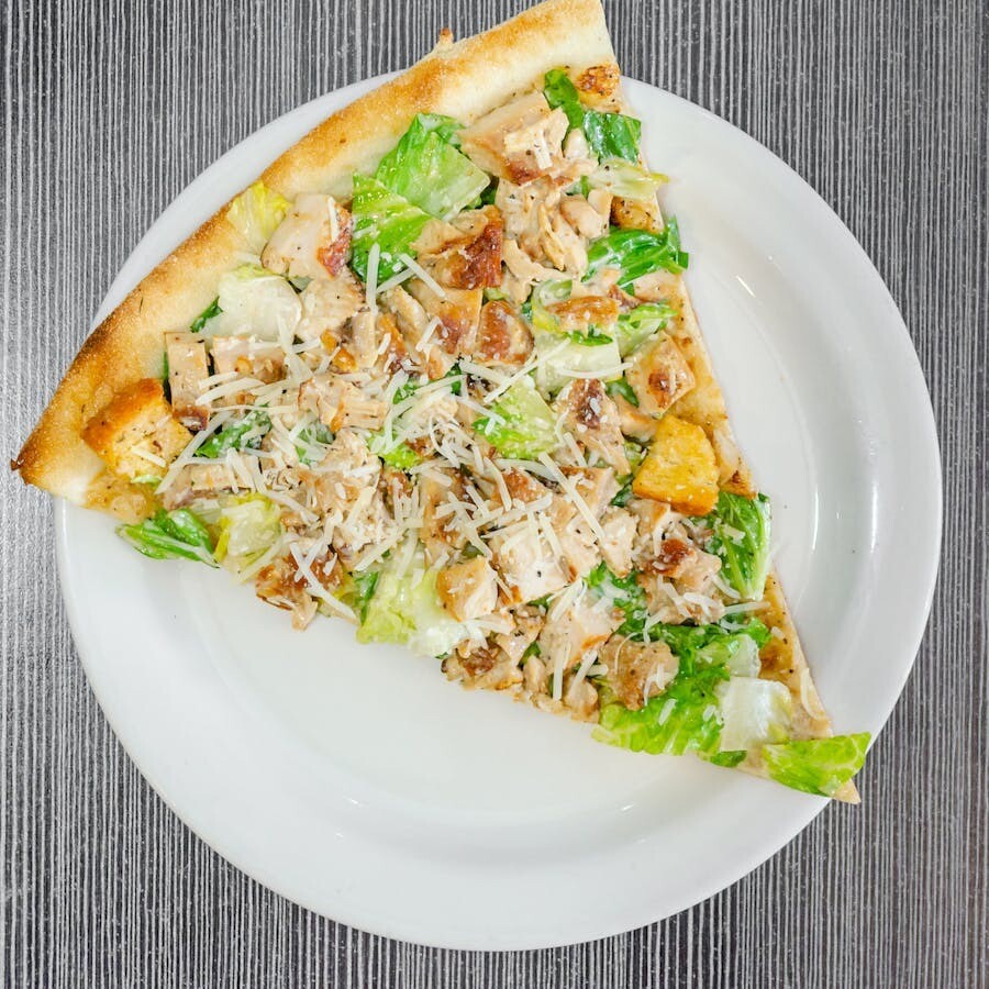 Discover the Irresistible Caesar Pizza: A Perfect Delight for Food Lovers at The Monroe Hotels