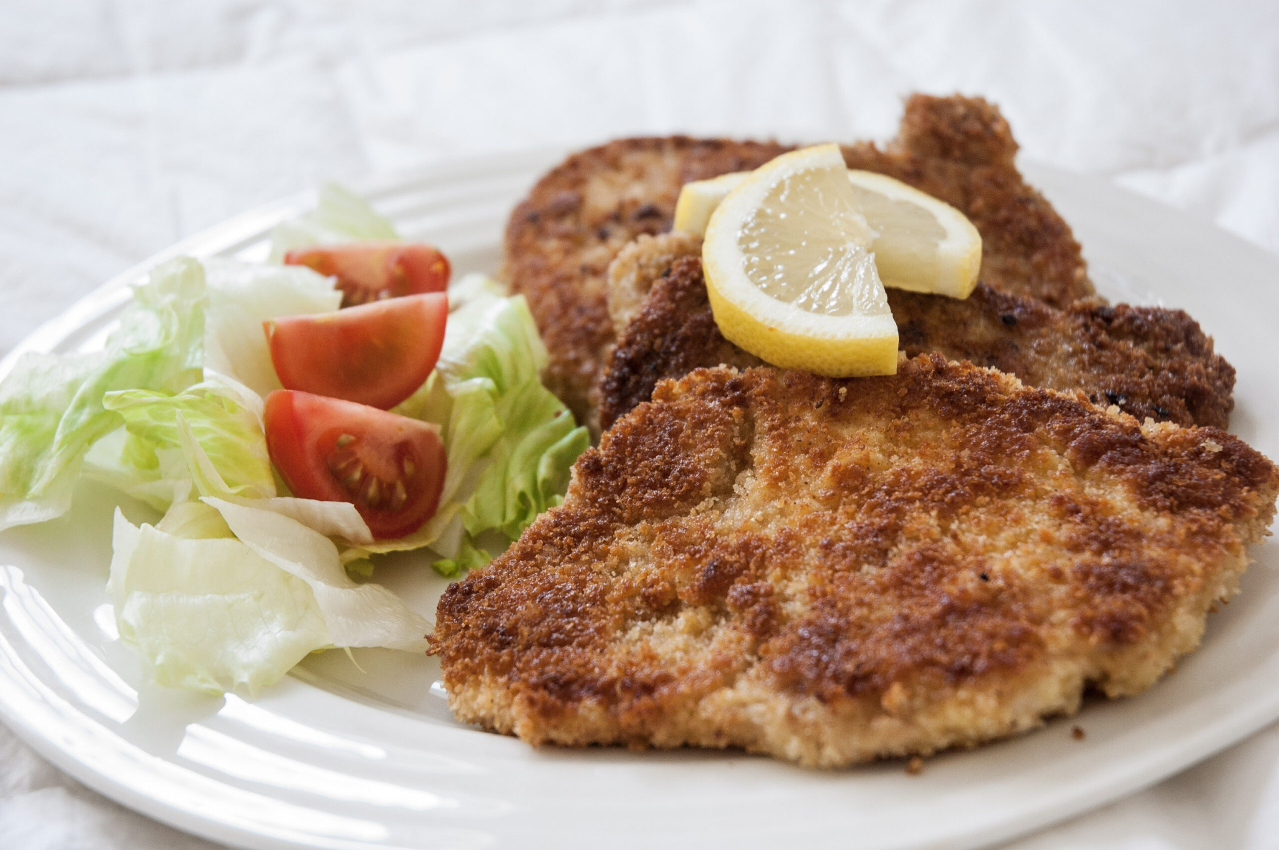 Pork Schnitzel: The Ultimate Guide to This Iconic Dish by The Monroe Hotels