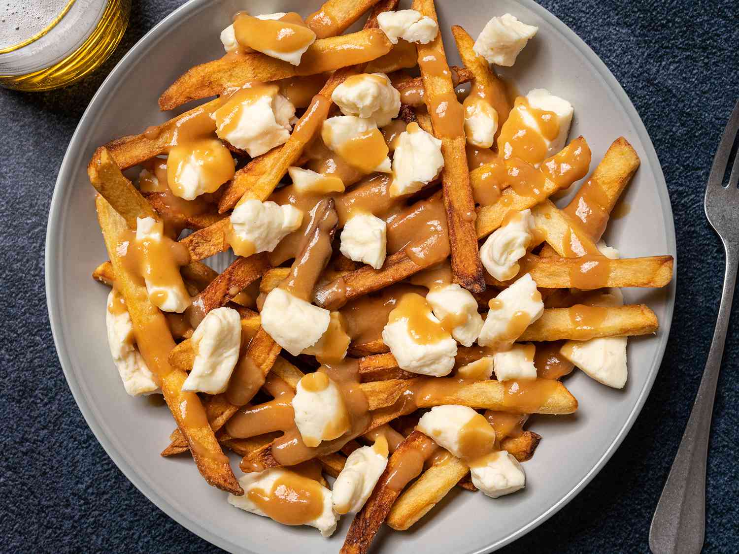 Poutine: The Ultimate Comfort Food You Need to Try – Discover it with The Monroe Hotels