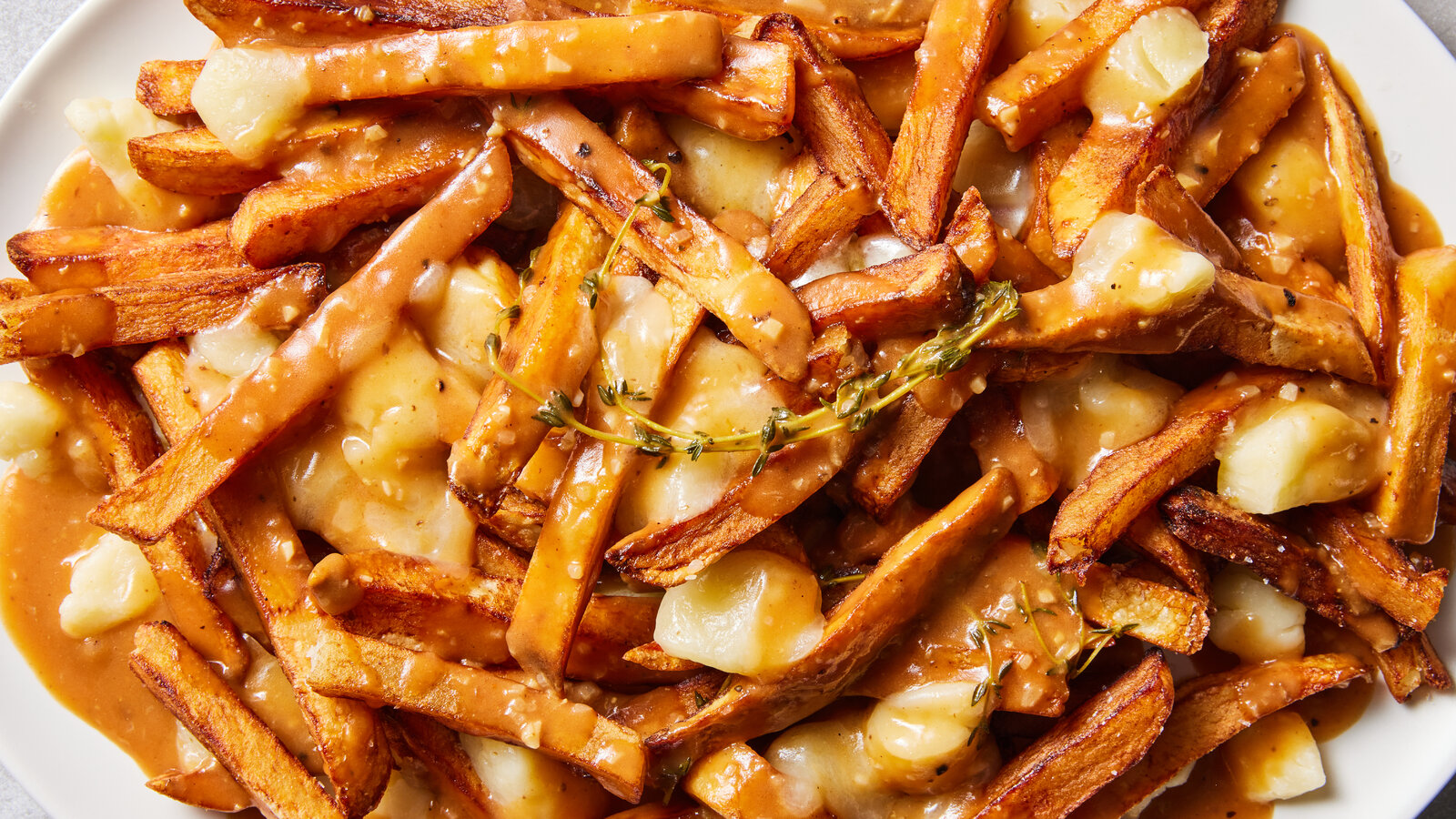 Poutine: The Ultimate Comfort Food You Need to Try – Discover it with The Monroe Hotels